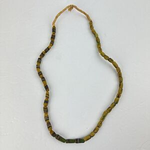 African Sand Cast Glass Trade Beads Handmade Green Earthtone Brown on Grass